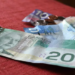 How many Canadians continue to use cash