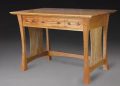 What is a writing desk called and how does it differ from other desks