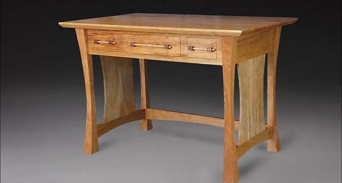 What is a writing desk called and how does it differ from other desks